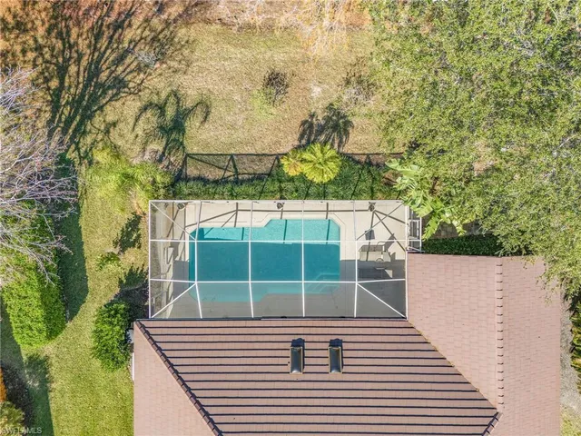 a view of a yard with a bench