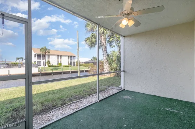 a view of a living room and a floor to ceiling window
