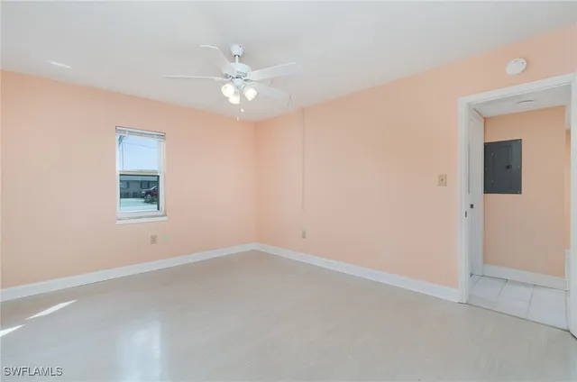 a view of an empty room with a fan