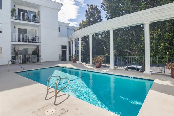 a house view with a seating space and balcony