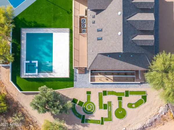 a view of a swimming pool with a lounge chair