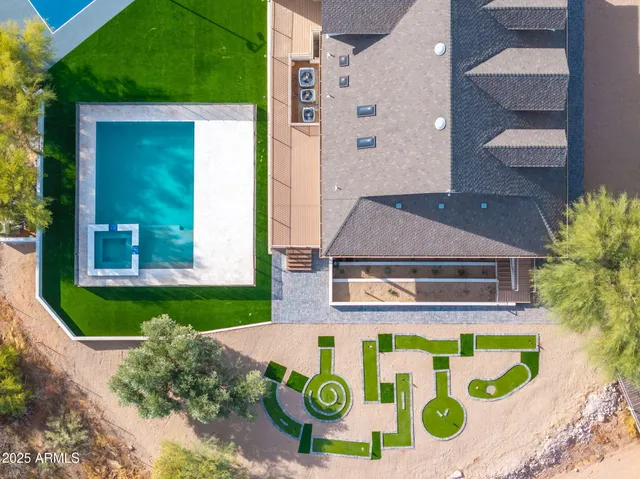 a view of a swimming pool with a lounge chair