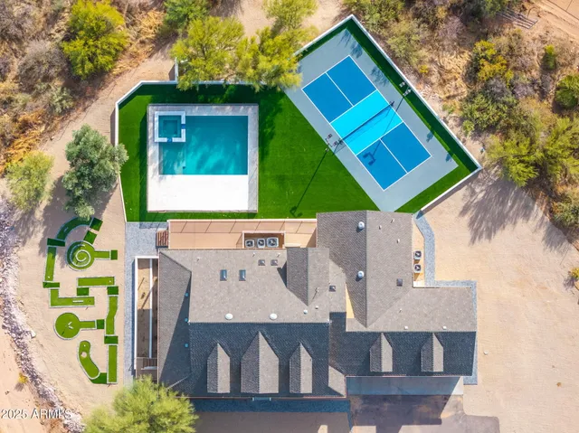a view of a swimming pool with an outdoor space and seating area