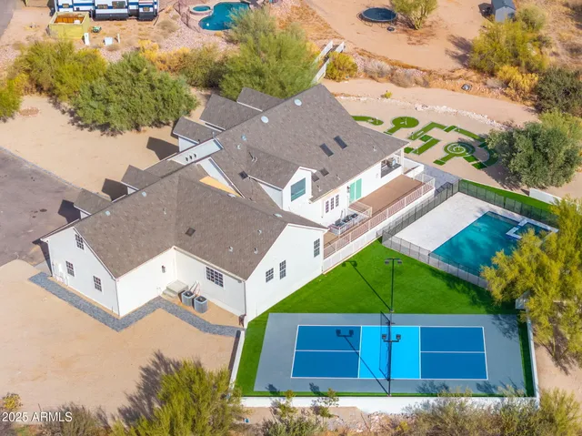 a view of a kitchen with a sink and a mirror