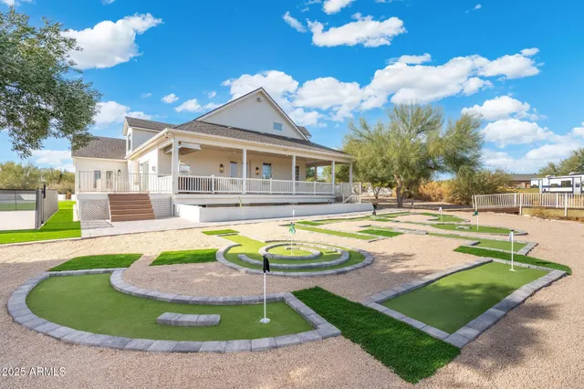 front view of a house with a lots of white walls