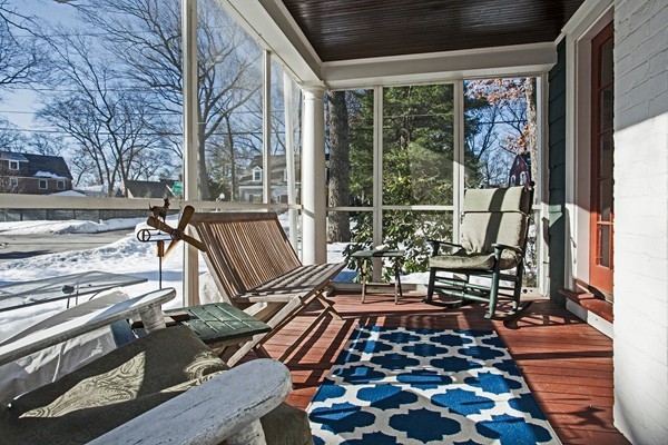 38 Dwhinda Road Newton, MA 02468 - Photo 19 of 30 a picture of a table and chairs in the balcony