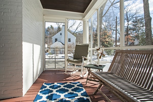 38 Dwhinda Road Newton, MA 02468 - Photo 20 of 30 a living room with a couch and a table