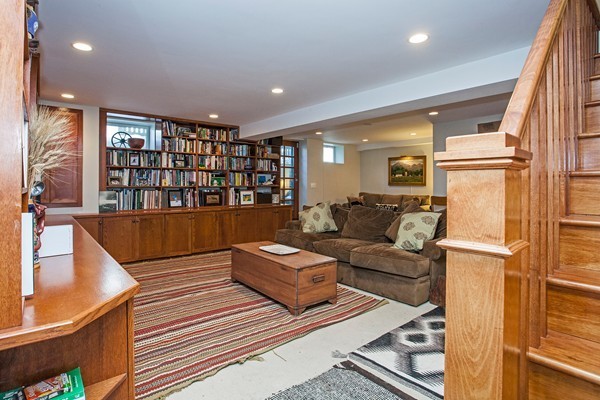 38 Dwhinda Road Newton, MA 02468 - Photo 2 of 30 a living room with furniture and a book shelf