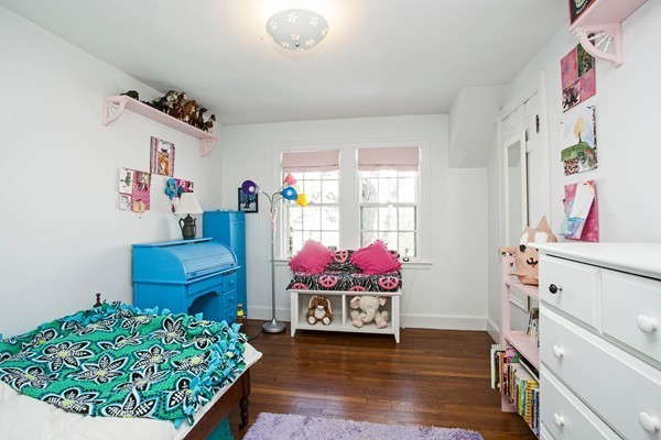 38 Dwhinda Road Newton, MA 02468 - Photo 26 of 30 a bedroom with furniture and a baby crib