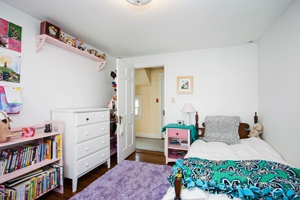 38 Dwhinda Road Newton, MA 02468 - Photo 27 of 30 a bedroom with furniture and a book shelf