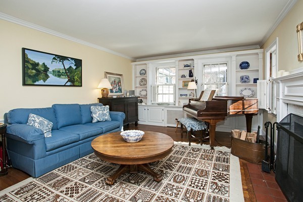 38 Dwhinda Road Newton, MA 02468 - Photo 9 of 30 a living room with fireplace furniture and a table