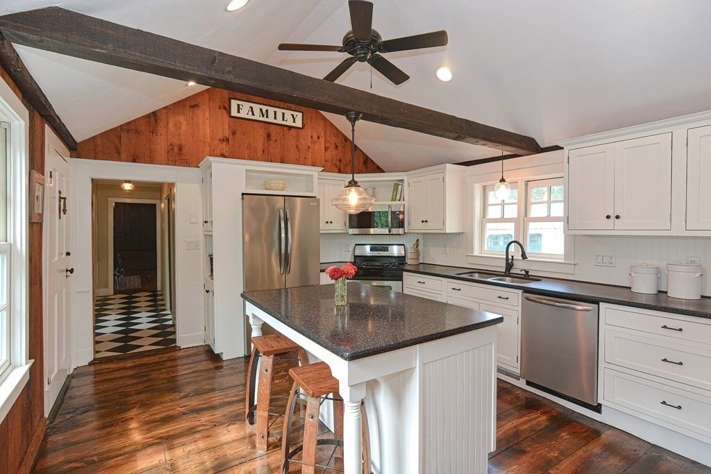 251 Gorwin Drive Holliston, MA 01746 - Photo 12 of 42 a kitchen with stainless steel appliances granite countertop a sink stove and refrigerator