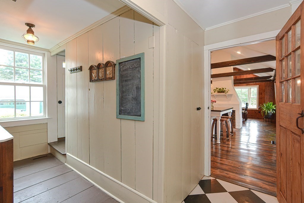 251 Gorwin Drive Holliston, MA 01746 - Photo 14 of 42 a living room with furniture and a table with wooden floor