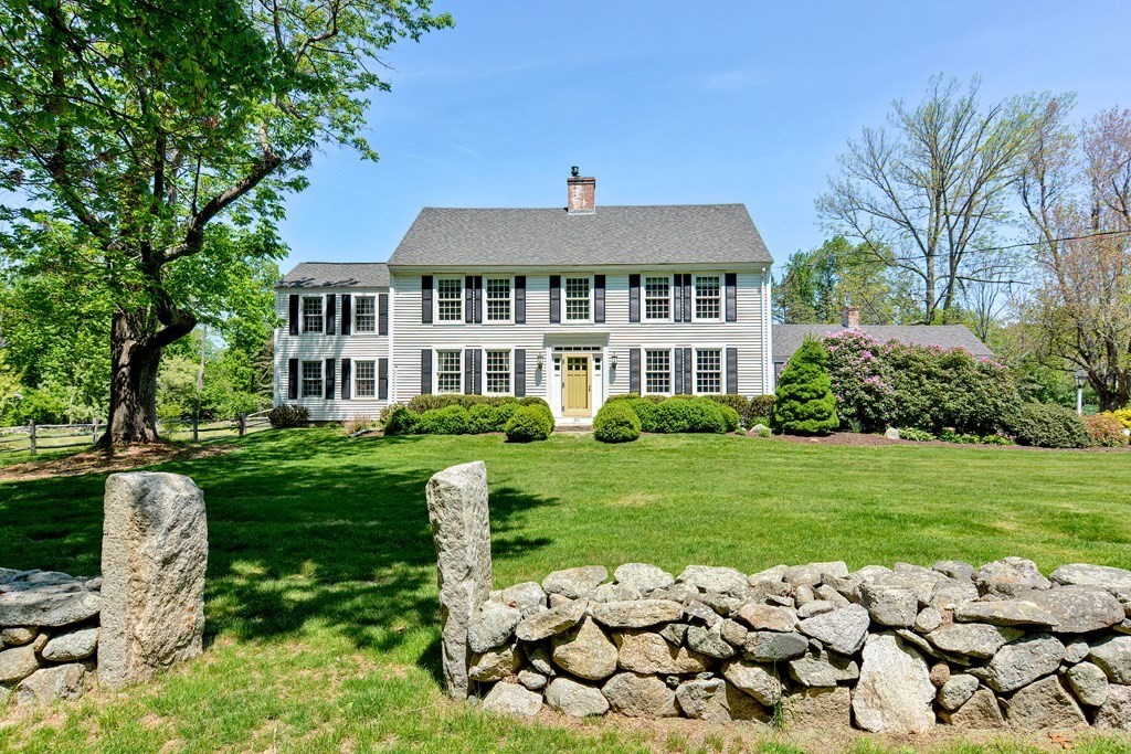 251 Gorwin Drive Holliston, MA 01746 - Photo 2 of 42 a front view of a house with a yard