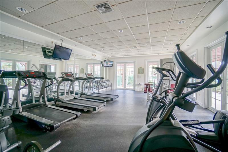 6702 West Sample Road, Unit 6702 Coral Springs, FL 33067 - Photo 7 of 8 a room with lots of gym equipment
