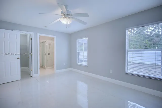 a view of an empty room with a window