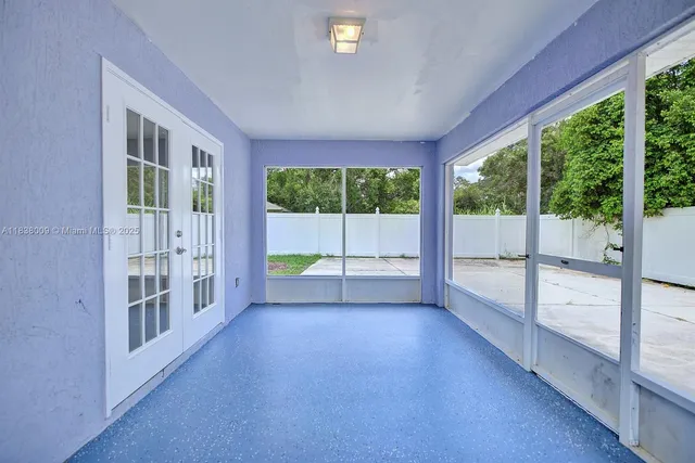 a view of an empty room with a balcony