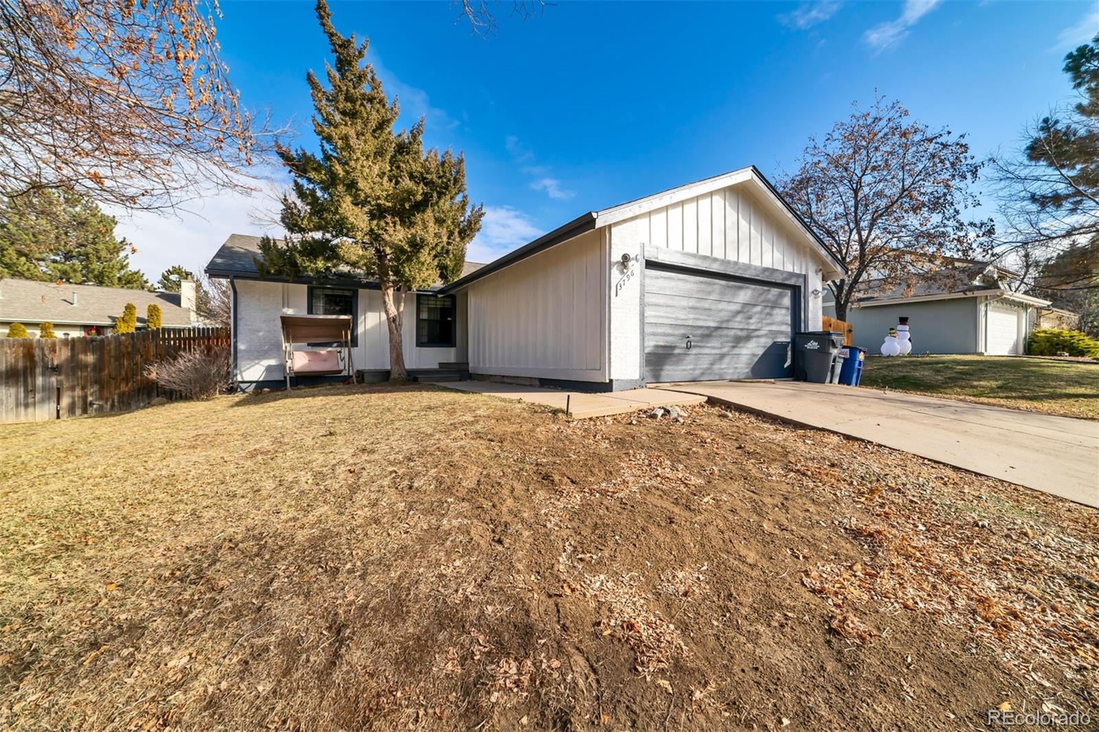 3796 South Ceylon Way Aurora, CO 80013 - Photo 1 of 16 a view of a house with a yard covered in snow