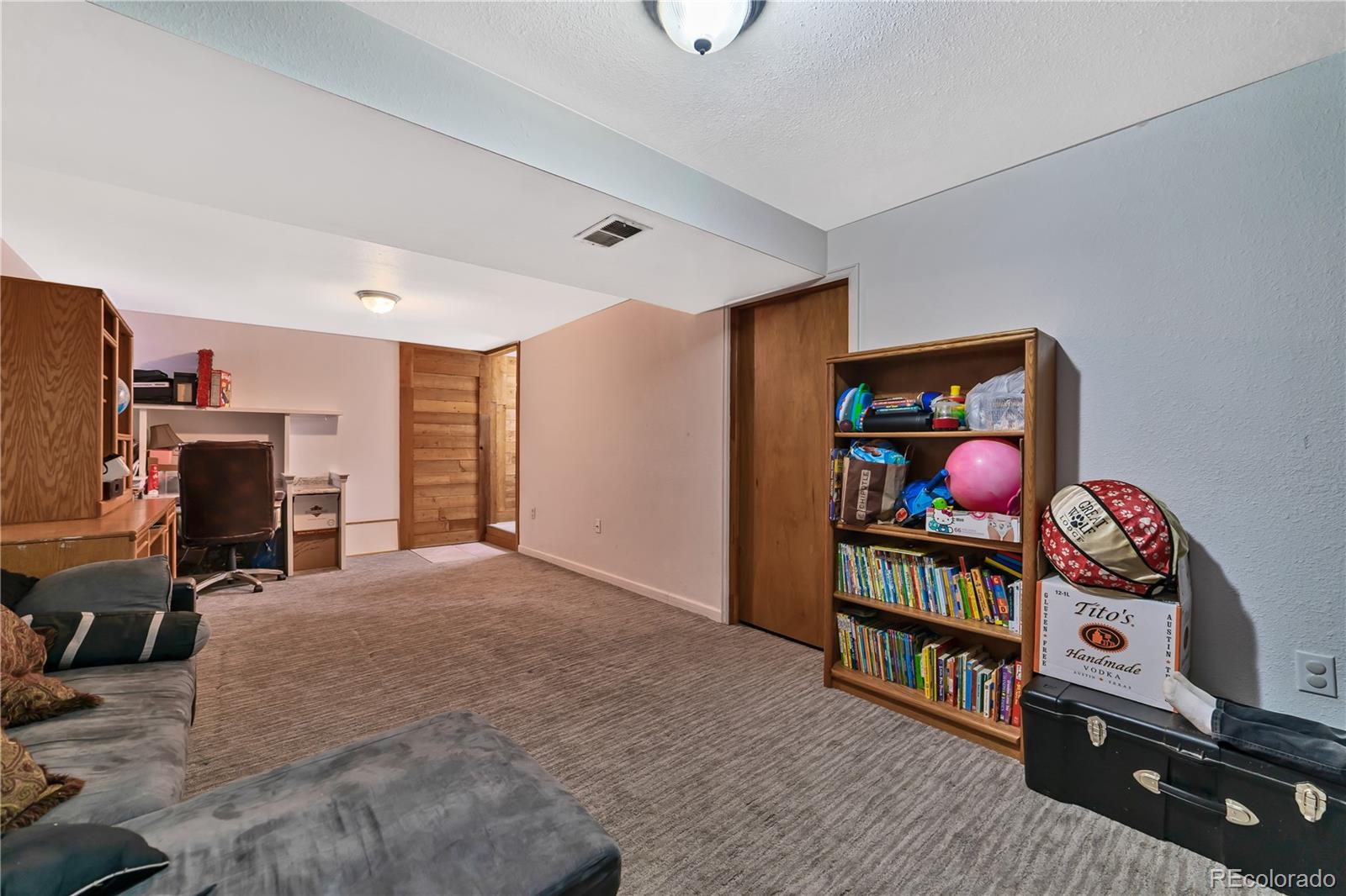 3796 South Ceylon Way Aurora, CO 80013 - Photo 15 of 16 a view of a livingroom with toys