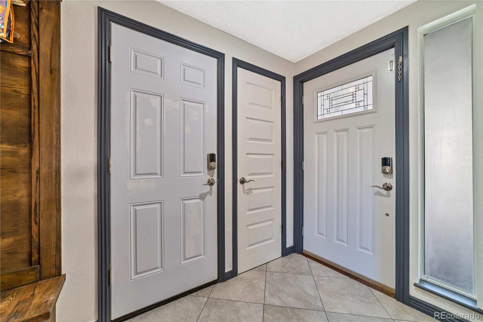 3796 South Ceylon Way Aurora, CO 80013 - Photo 2 of 16 a view of a hallway with front door