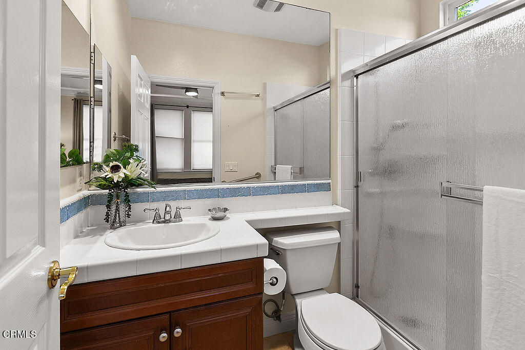14216 Oneida Court Moorpark, CA 93021 - Photo 12 of 75 a bathroom with a sink toilet vanity and shower