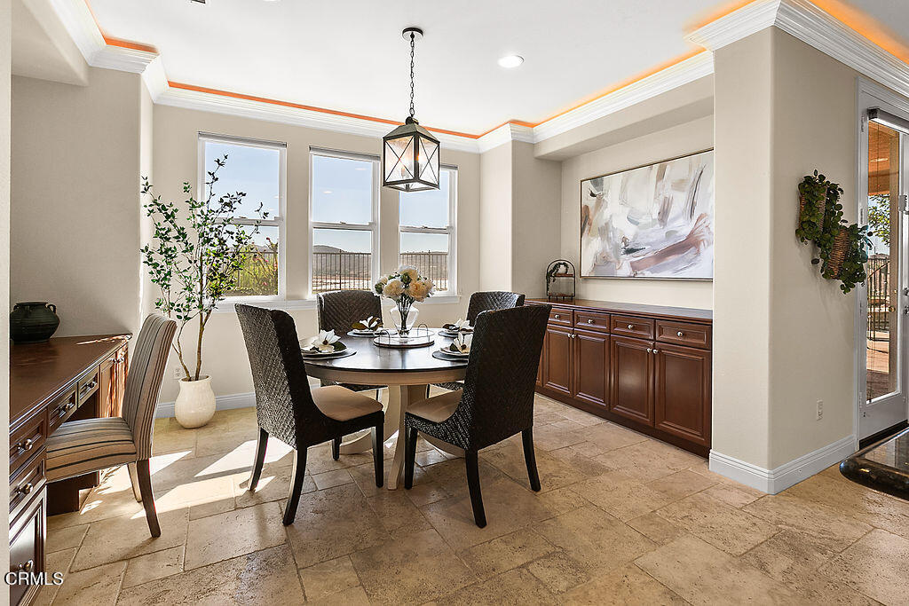 14216 Oneida Court Moorpark, CA 93021 - Photo 15 of 75 a view of a dining room with furniture and chandelier