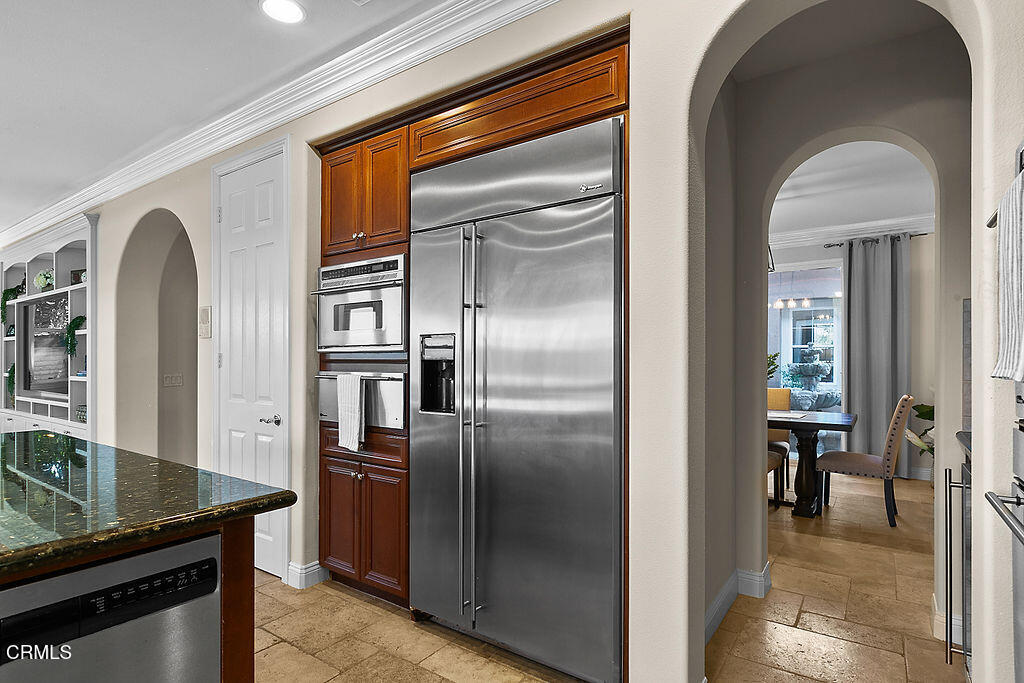 14216 Oneida Court Moorpark, CA 93021 - Photo 22 of 75 a kitchen with stainless steel appliances granite countertop a refrigerator and a stove