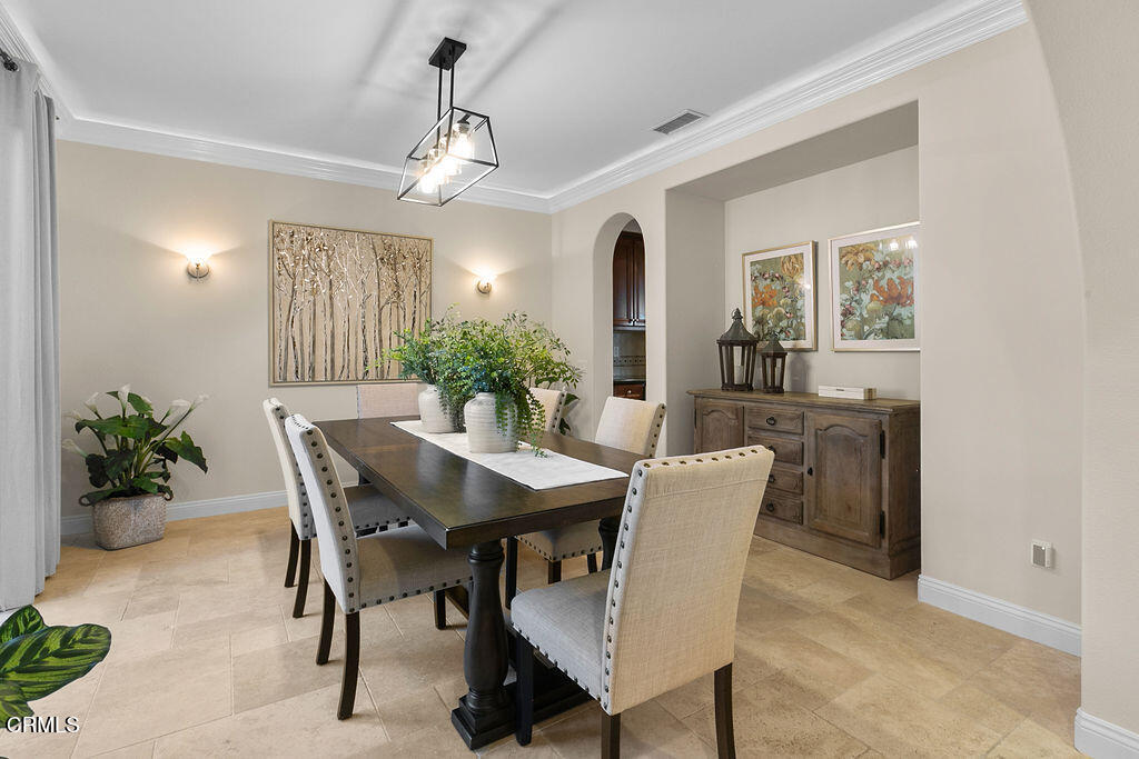 14216 Oneida Court Moorpark, CA 93021 - Photo 23 of 75 a dining room with furniture potted plants and wooden floor