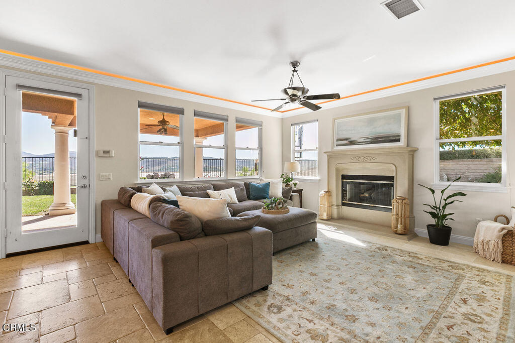 14216 Oneida Court Moorpark, CA 93021 - Photo 26 of 75 a living room with furniture and a fireplace