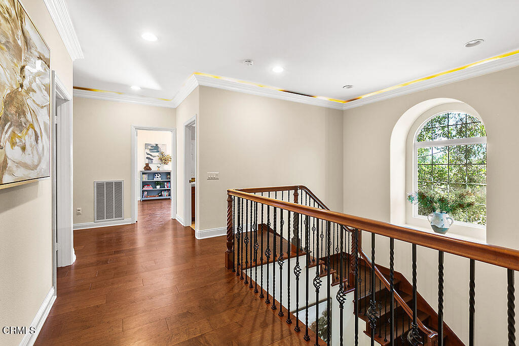 14216 Oneida Court Moorpark, CA 93021 - Photo 36 of 75 a view of hallway with wooden floor and a fireplace