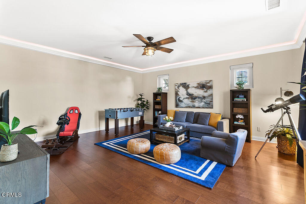 14216 Oneida Court Moorpark, CA 93021 - Photo 37 of 75 a living room with furniture gym equipment and a large window