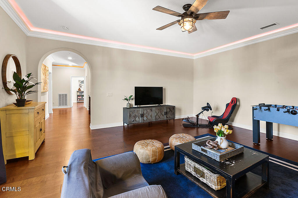 14216 Oneida Court Moorpark, CA 93021 - Photo 38 of 75 a living room with furniture and a flat screen tv
