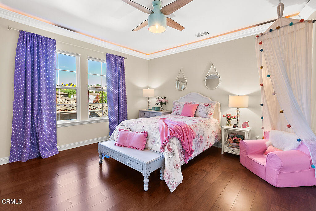 14216 Oneida Court Moorpark, CA 93021 - Photo 40 of 75 a bedroom with a bed and wooden floor