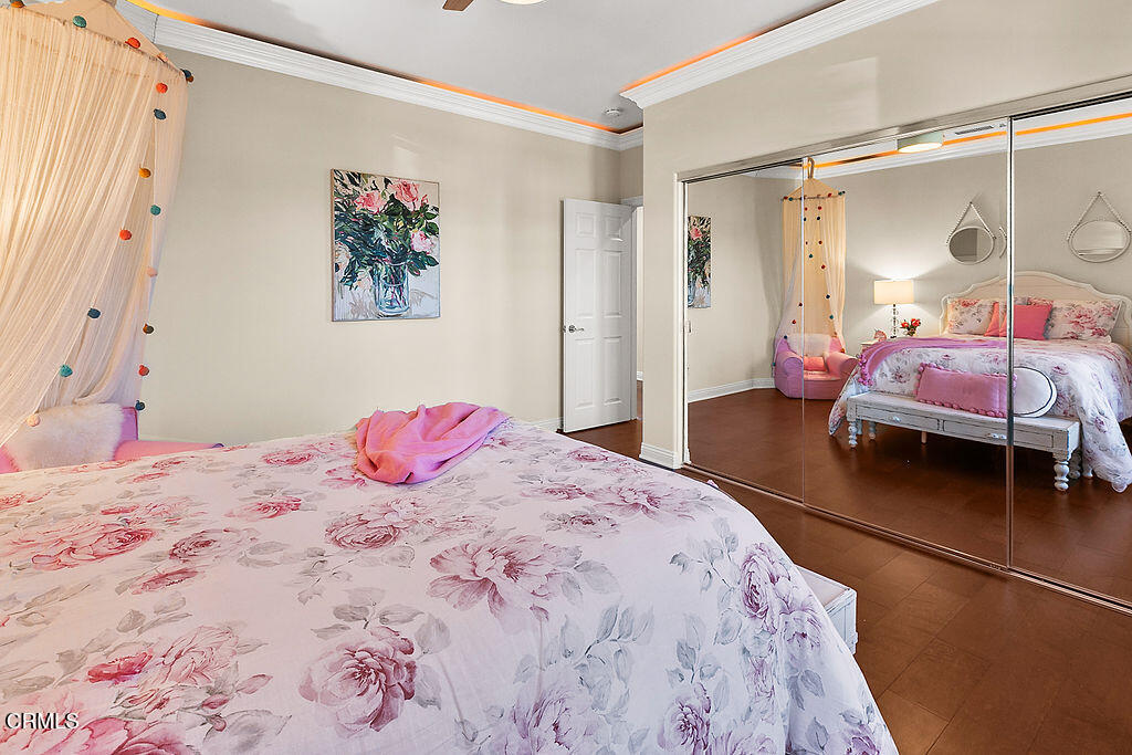 14216 Oneida Court Moorpark, CA 93021 - Photo 42 of 75 a bedroom with a bed and a mirror
