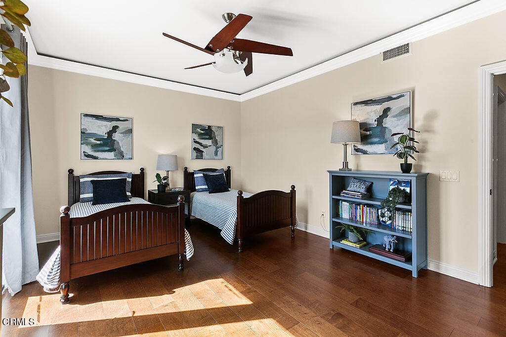 14216 Oneida Court Moorpark, CA 93021 - Photo 46 of 75 a living room with furniture and a book shelf