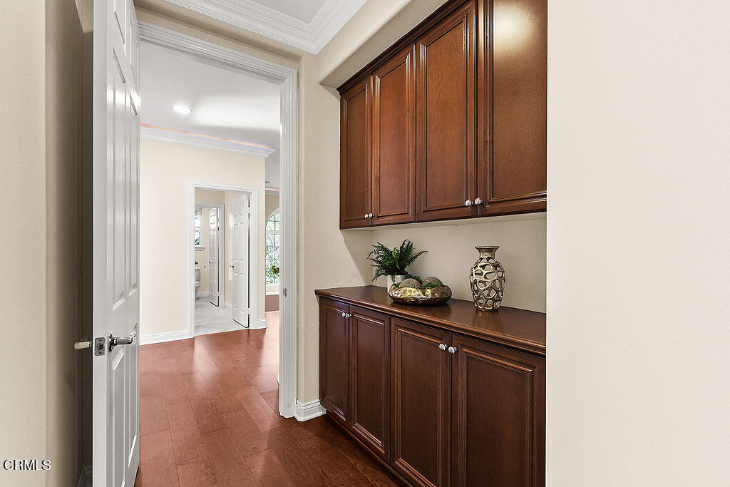 14216 Oneida Court Moorpark, CA 93021 - Photo 51 of 75 a view of a kitchen with wooden floor and cabinets