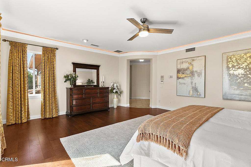 14216 Oneida Court Moorpark, CA 93021 - Photo 55 of 75 a bedroom with a bed and wooden floor