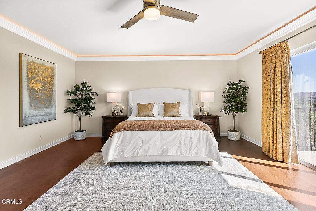 14216 Oneida Court Moorpark, CA 93021 - Photo 57 of 75 a bedroom with a large bed and a potted plant