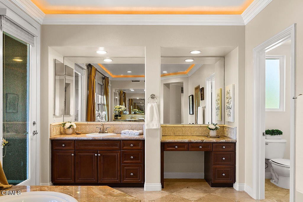 14216 Oneida Court Moorpark, CA 93021 - Photo 64 of 75 a bathroom with a double vanity sink mirror and double