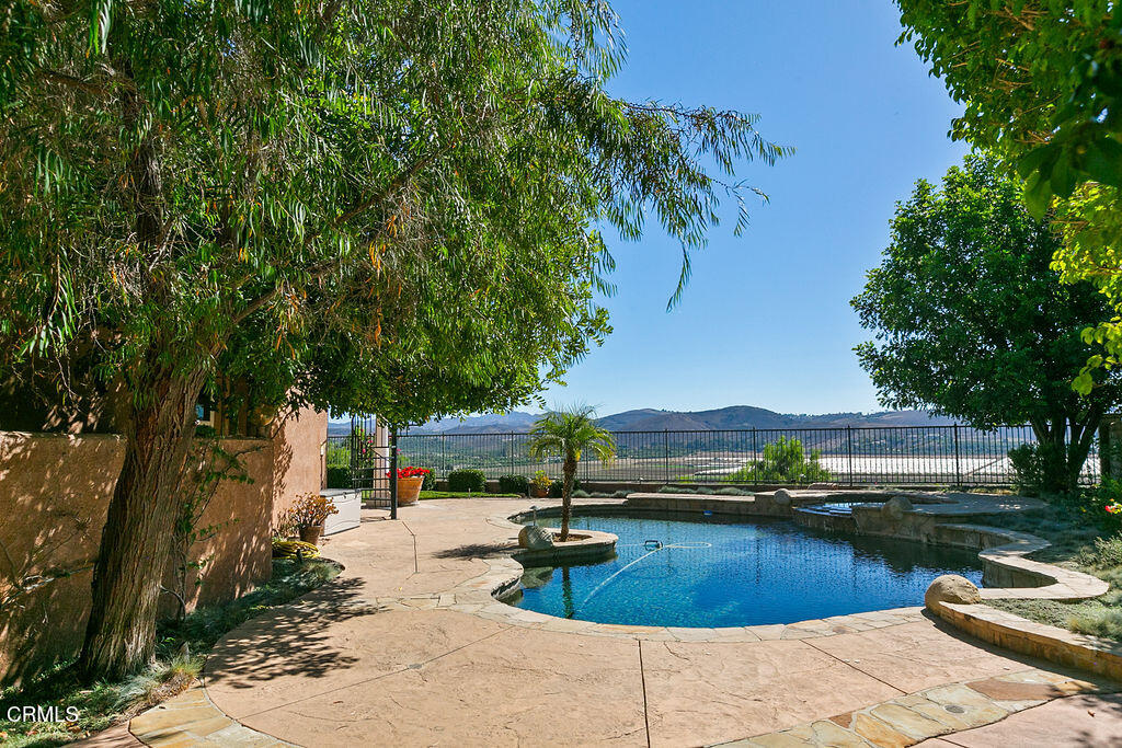 14216 Oneida Court Moorpark, CA 93021 - Photo 70 of 75 a swimming pool with outdoor seating and yard