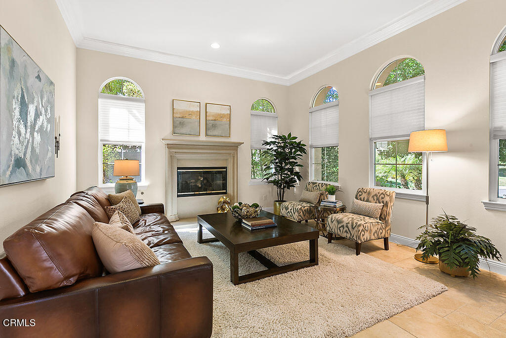 14216 Oneida Court Moorpark, CA 93021 - Photo 7 of 75 a living room with furniture fireplace and a potted plant