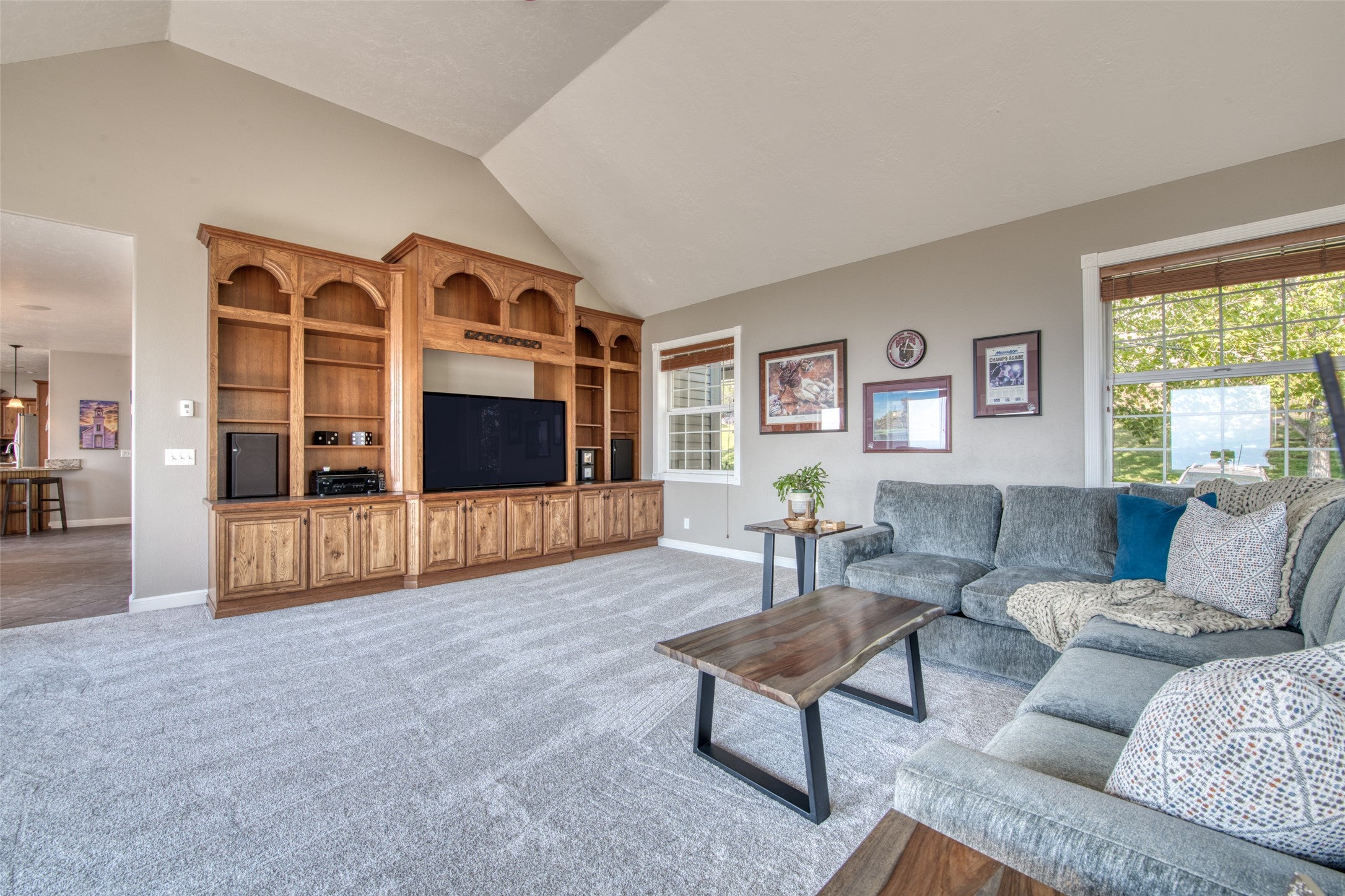 16374 Folsom Road Florence, MT 59833 - Photo 52 of 98 Living area with light colored carpet and high vaulted ceiling