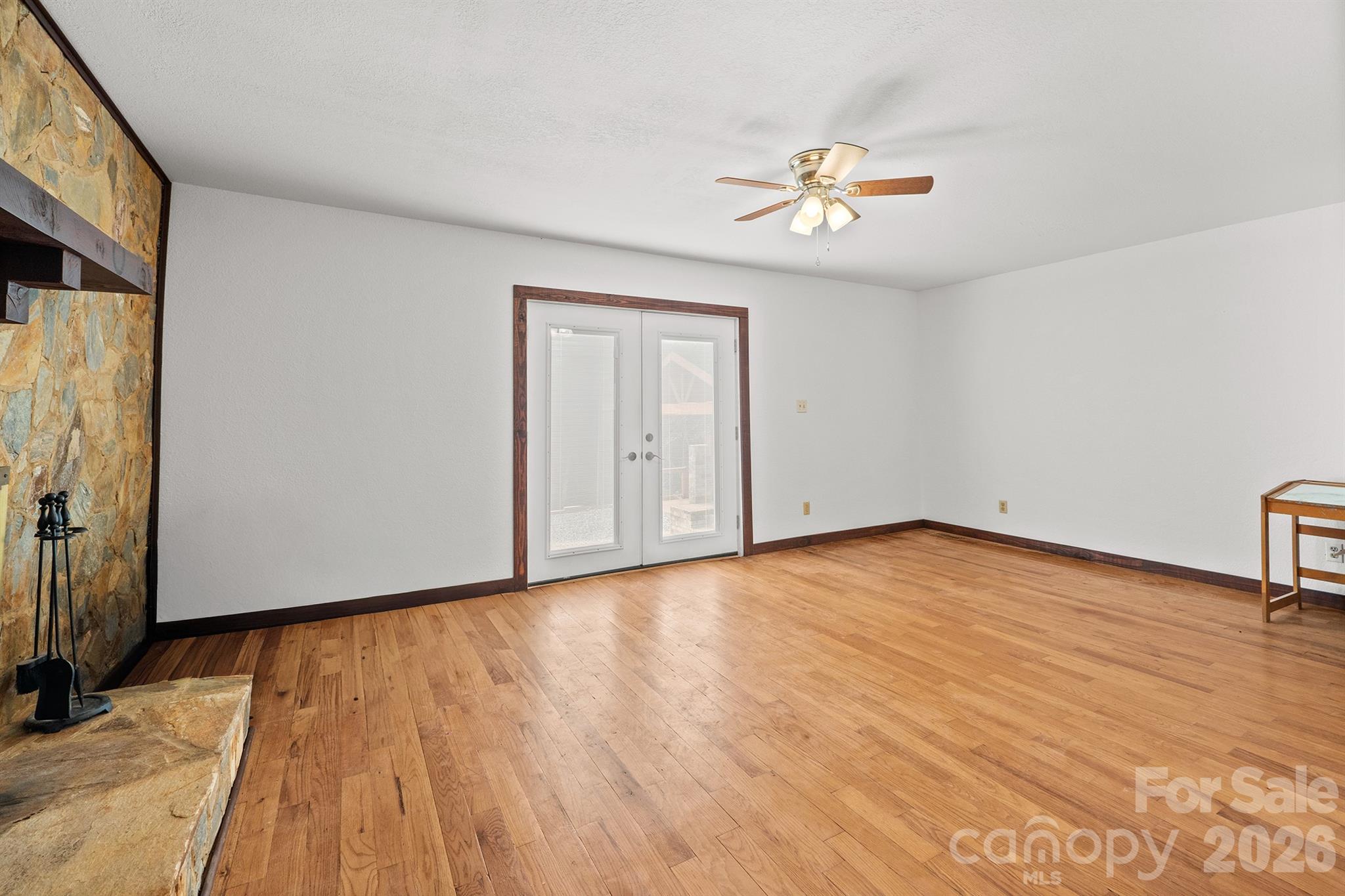 7400 Corn Hill Road Connelly Springs, NC 28612 - Photo 32 of 41 a view of empty room with wooden floor and fan