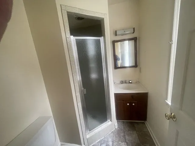 a bathroom with a sink and mirror