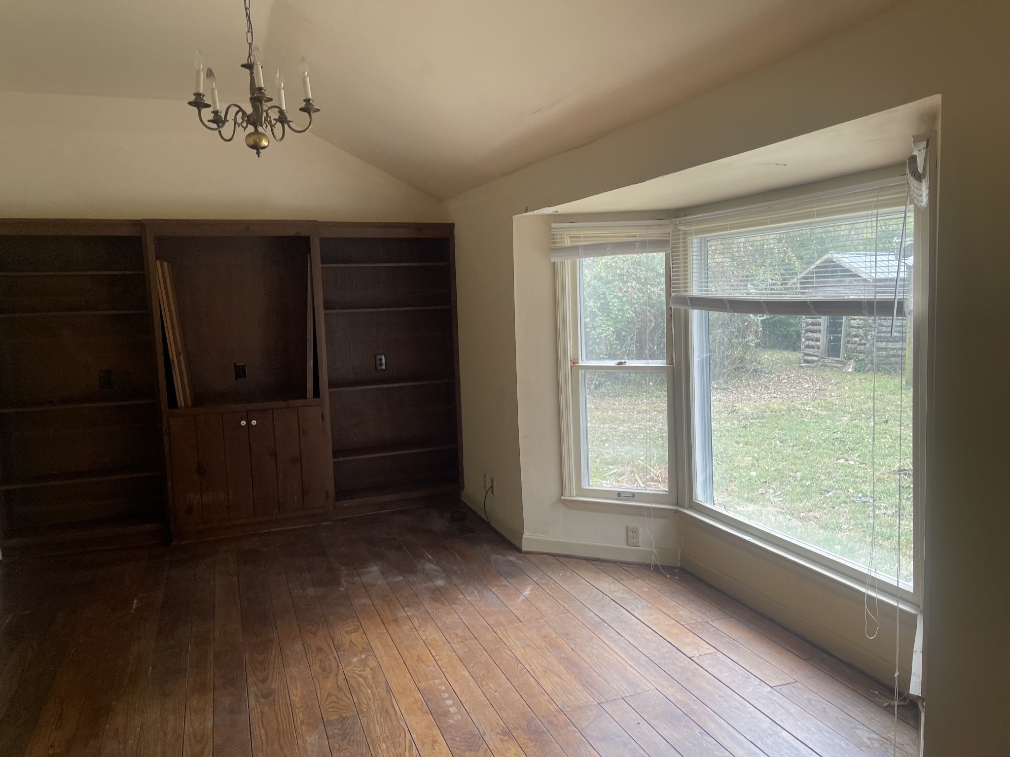 3088 Hillsboro Road Brentwood, TN 37027 - Photo 13 of 18 a view of an empty room with a window and wooden floor