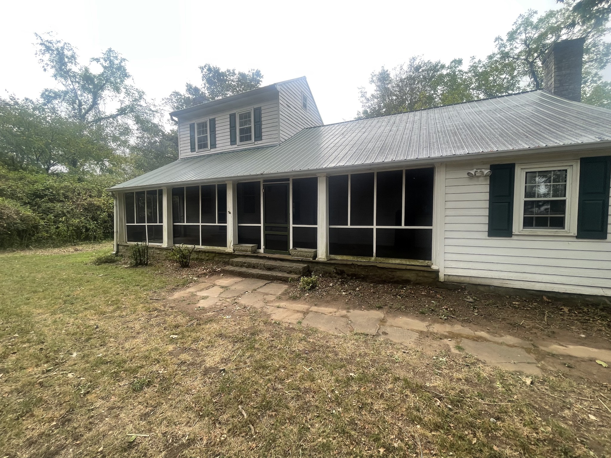 3088 Hillsboro Road Brentwood, TN 37027 - Photo 2 of 18 a view of a house with a yard