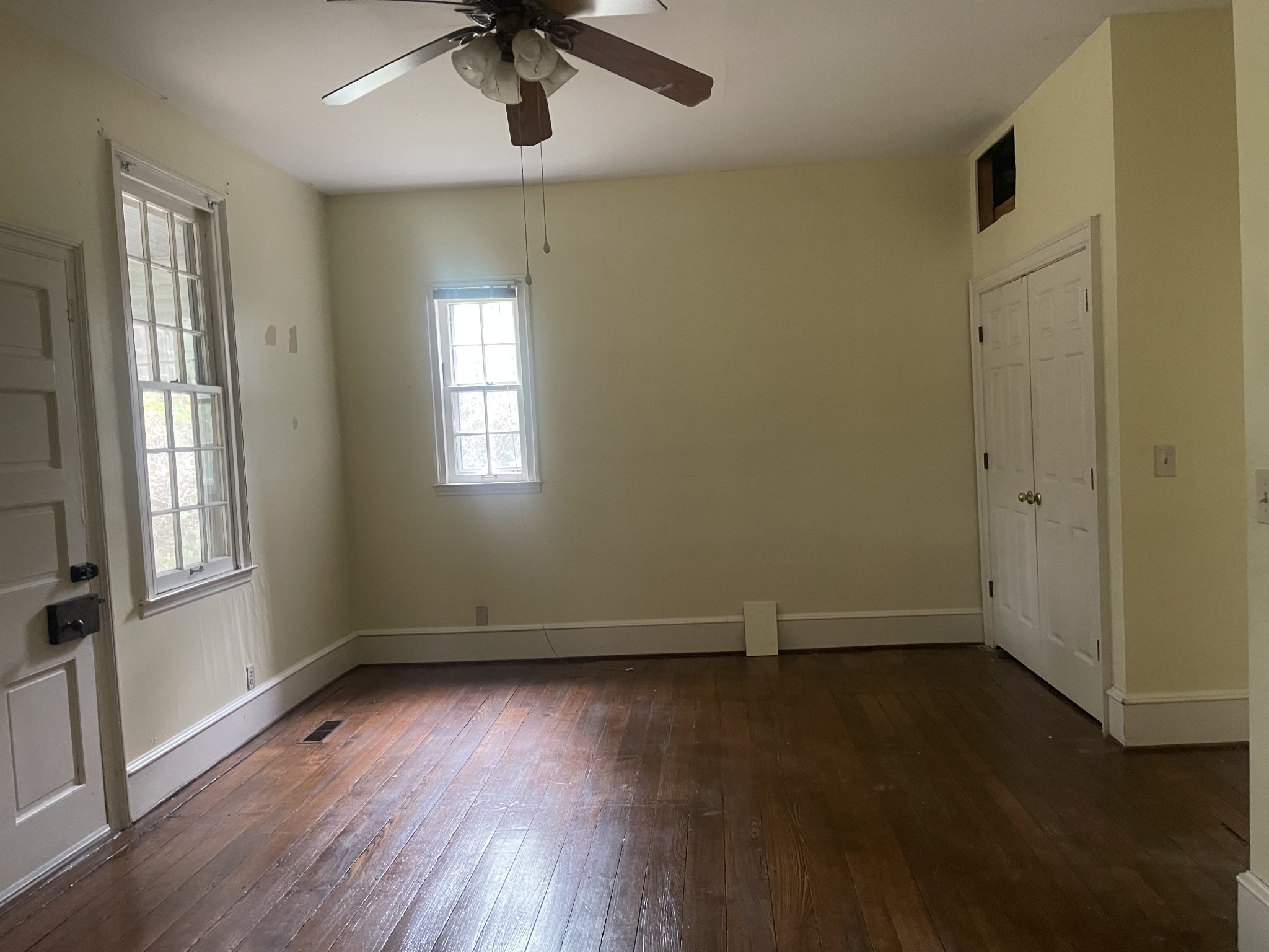 3088 Hillsboro Road Brentwood, TN 37027 - Photo 8 of 18 an empty room with wooden floor fan and windows