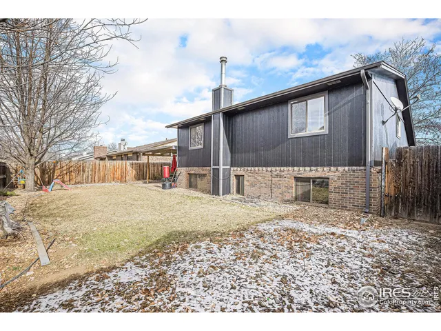 a backyard of a house with a yard and garage