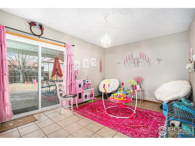 a view of a dining room with furniture wooden floor and a chandelier