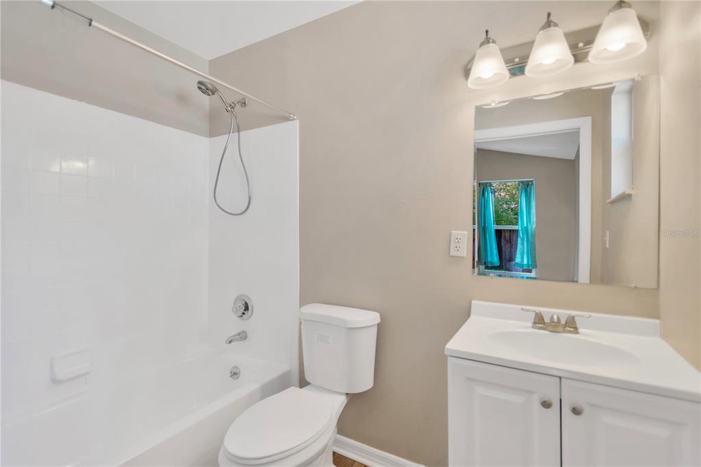 3600 Raintree Terrace Lakeland, FL 33803 - Photo 18 of 22 a bathroom with a sink a toilet and shower